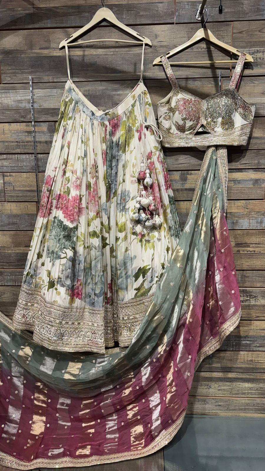 Pure Kora Silk ( All weather silk) with mesmerising floral digital print with handwork over the skirt border and complete blouse highlights teamed up with dual color organza dupatta with beautiful border must have for wedding ceremonial events