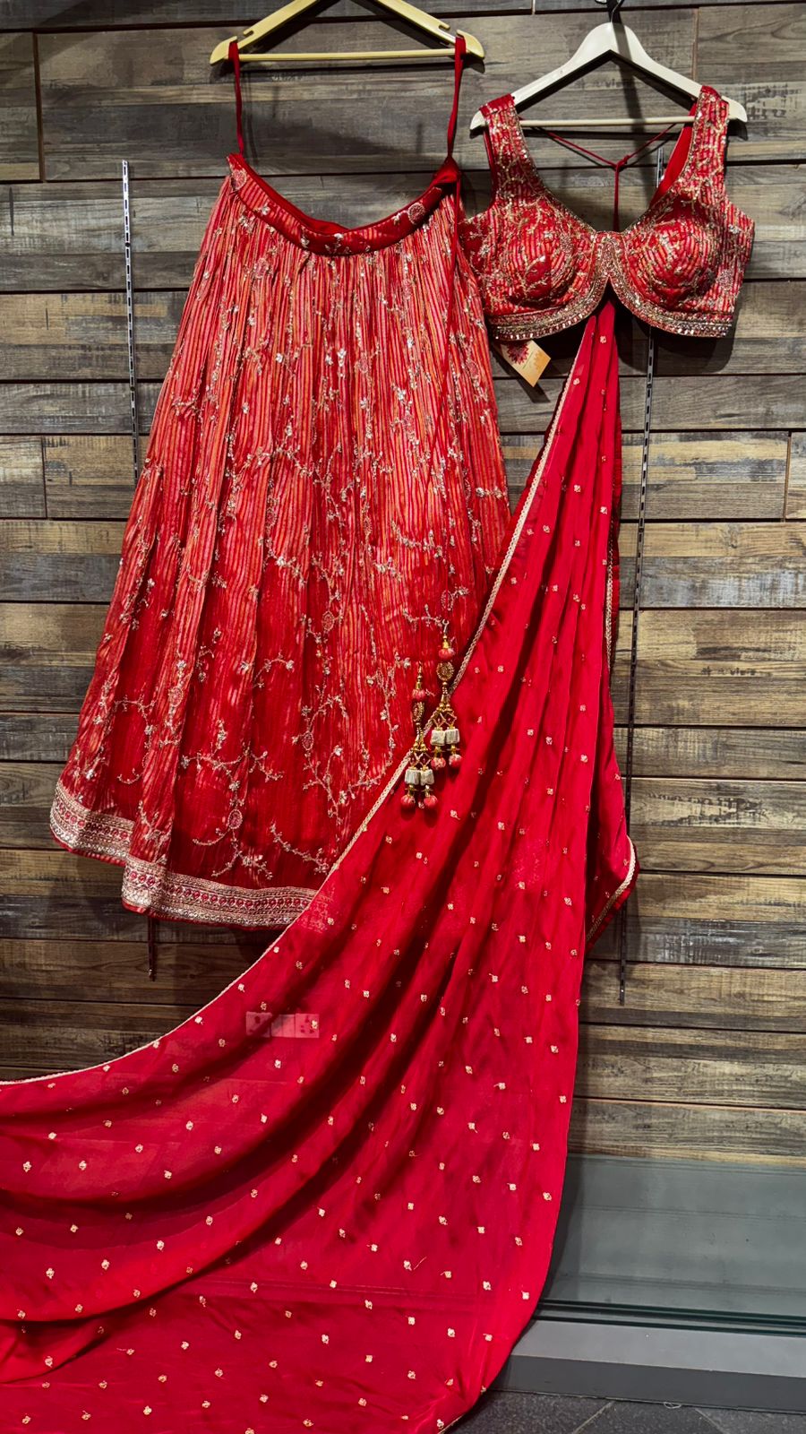 Pure Organza Blooming Red Color Lehenga with weaving all over teamed up with intricate handwork over skirt and on blouse teamed up with organza dupatta in handwork highlights all over to brighten up your wedding affairs