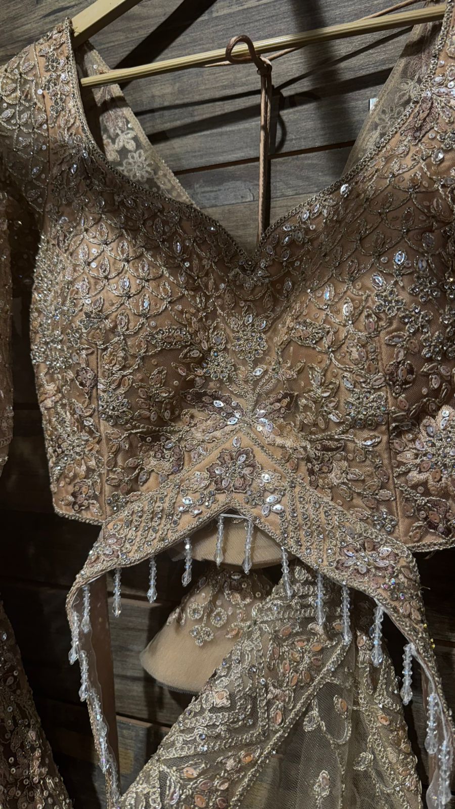 Imported Net Golden Lehenga with beautiful handwork in thread and sequence teamed with full handwork dupatta and blouse to brighten up your wedding affairs