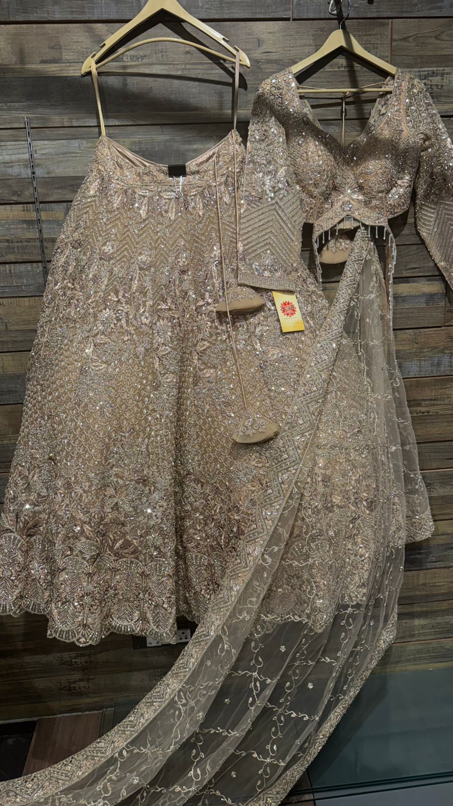 Imported Net Golden Lehenga with beautiful handwork in thread and sequence teamed with full handwork dupatta and blouse to brighten up your wedding affairs