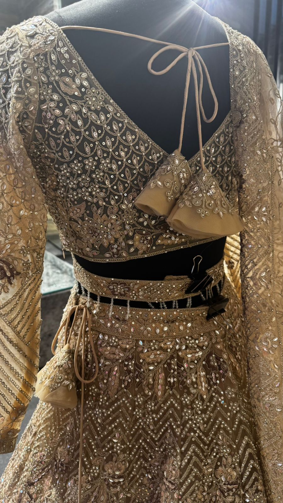 Imported Net Golden Lehenga with beautiful handwork in thread and sequence teamed with full handwork dupatta and blouse to brighten up your wedding affairs