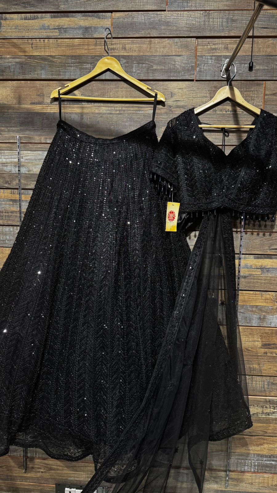 Imported Net Black Lehenga with beautiful handwork in thread and sequence teamed with full handwork blouse to brighten up your cocktail affairs