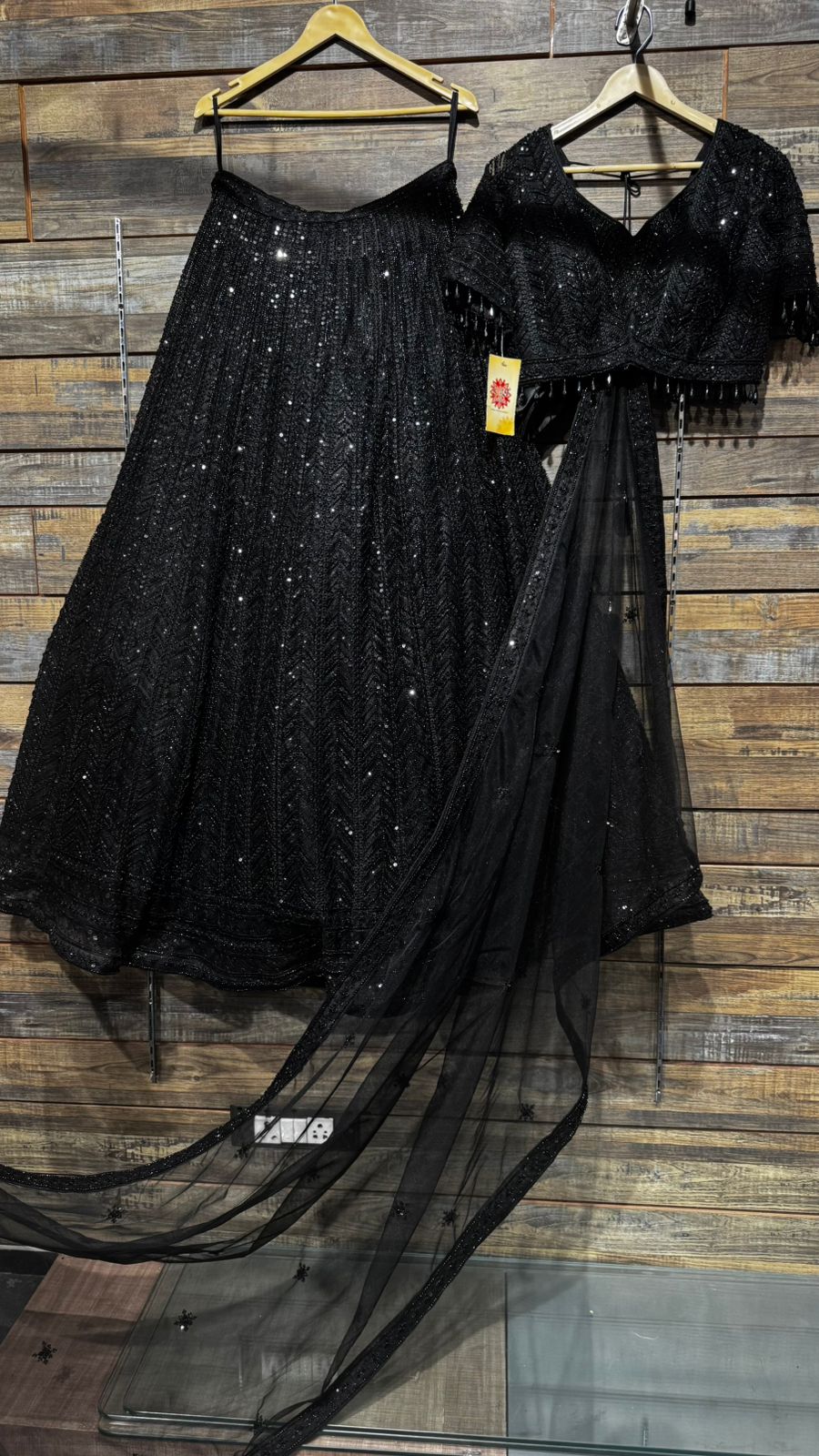 Imported Net Black Lehenga with beautiful handwork in thread and sequence teamed with full handwork blouse to brighten up your cocktail affairs