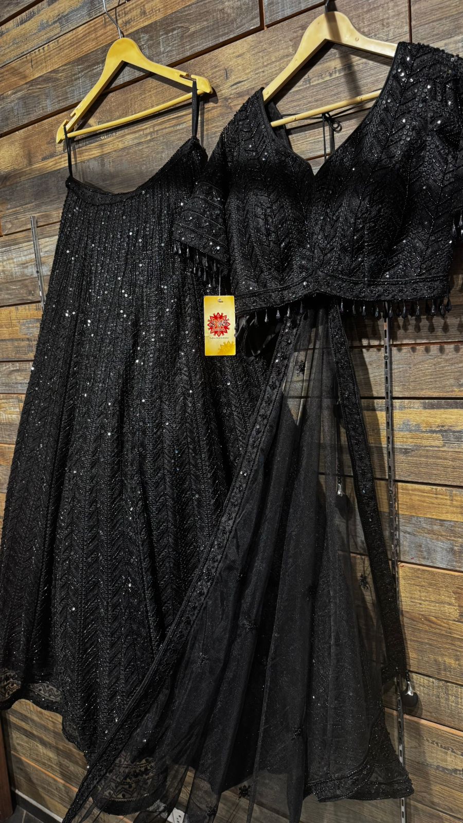 Imported Net Black Lehenga with beautiful handwork in thread and sequence teamed with full handwork blouse to brighten up your cocktail affairs