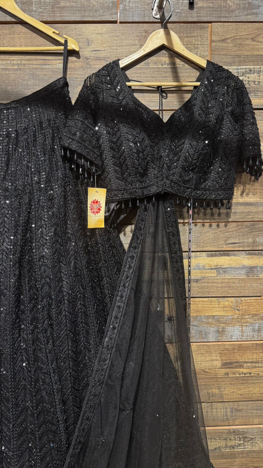 Imported Net Black Lehenga with beautiful handwork in thread and sequence teamed with full handwork blouse to brighten up your cocktail affairs