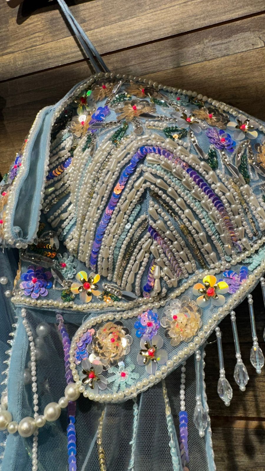 Imported Net Powder Blue Lehenga with beautiful handwork in pearl and appliqué teamed with full handwork blouse in beads with dropping shoulders along with two panels doing down to brighten up your ceremonial affairs