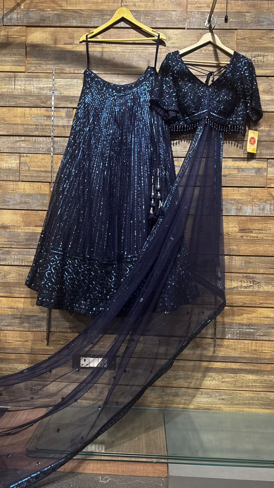 Imported Net Powder Blue Lehenga with beautiful handwork in sequence and beads teamed with full handwork blouse to brighten up your ceremonial affairs