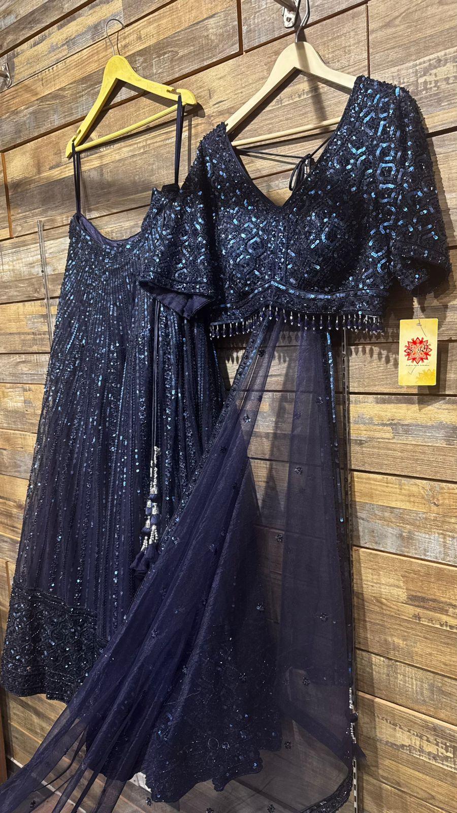 Imported Net Powder Blue Lehenga with beautiful handwork in sequence and beads teamed with full handwork blouse to brighten up your ceremonial affairs