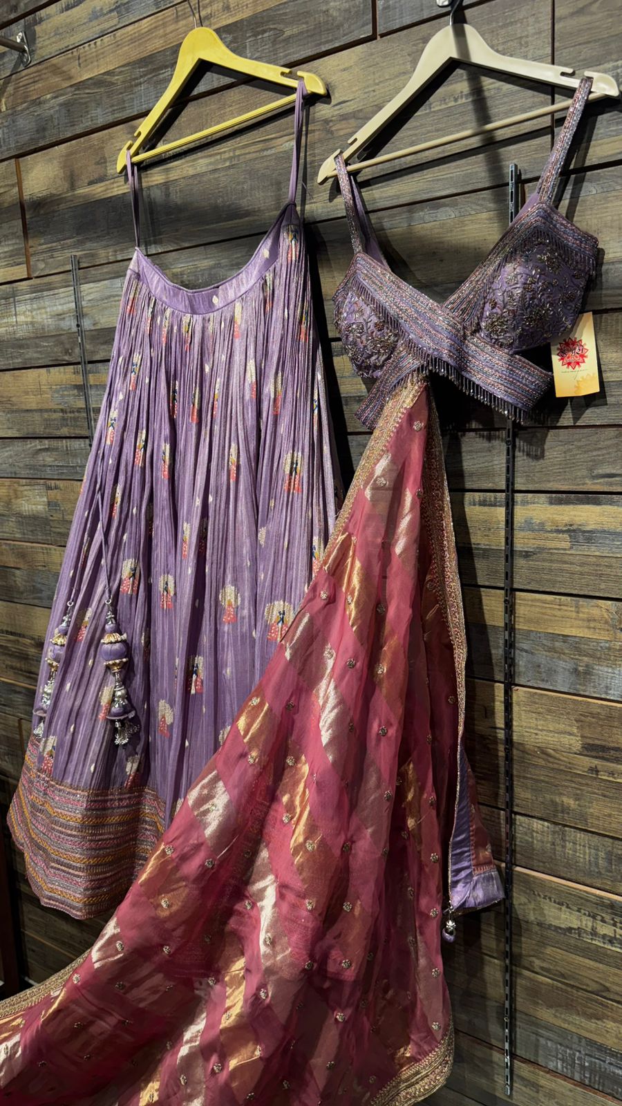 Lavender Color Lehenga with beautiful crush banarsi tissue fabric with banarsi weaving over the skirt and intricate handwork on blouse with criss cross neck pattern and organza dupatta with tissue patta weaving