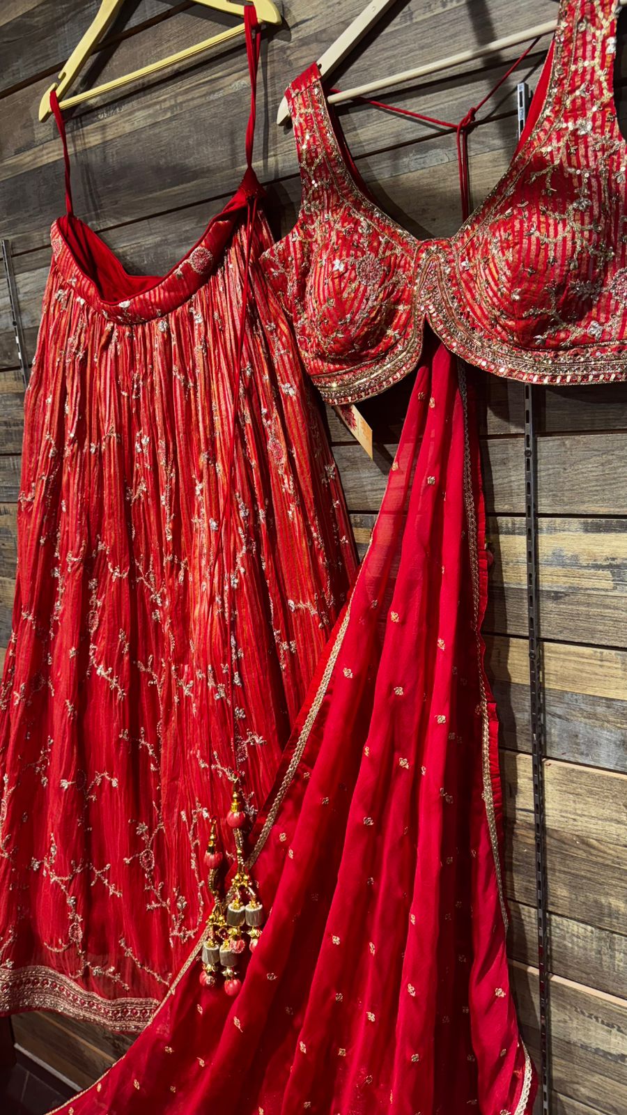 Pure Organza Blooming Red Color Lehenga with weaving all over teamed up with intricate handwork over skirt and on blouse teamed up with organza dupatta in handwork highlights all over to brighten up your wedding affairs