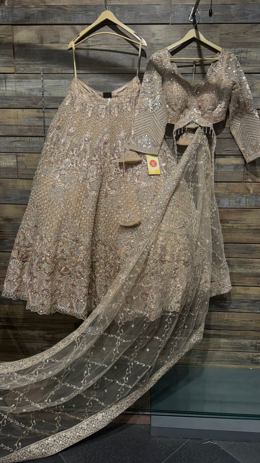 Imported Net Golden Lehenga with beautiful handwork in thread and sequence teamed with full handwork dupatta and blouse to brighten up your wedding affairs