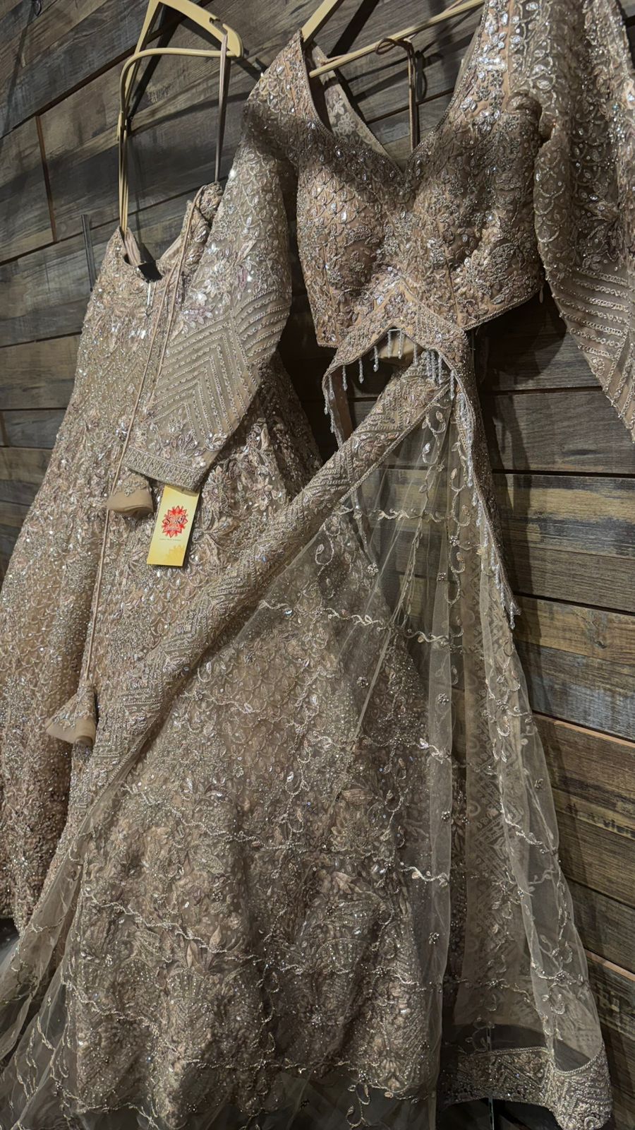 Imported Net Golden Lehenga with beautiful handwork in thread and sequence teamed with full handwork dupatta and blouse to brighten up your wedding affairs