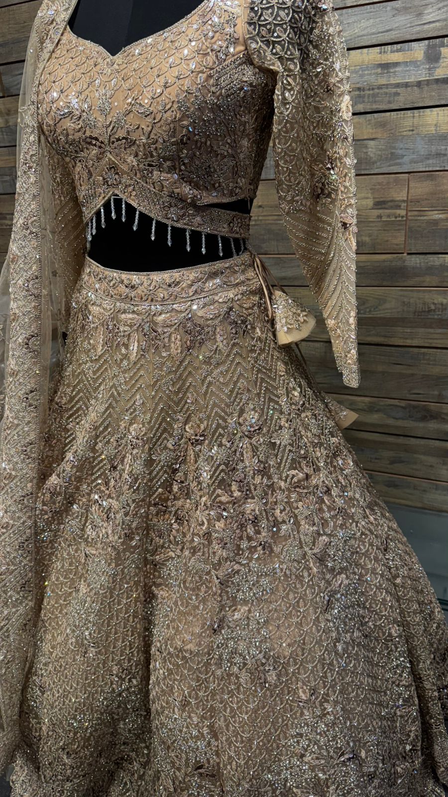 Imported Net Golden Lehenga with beautiful handwork in thread and sequence teamed with full handwork dupatta and blouse to brighten up your wedding affairs