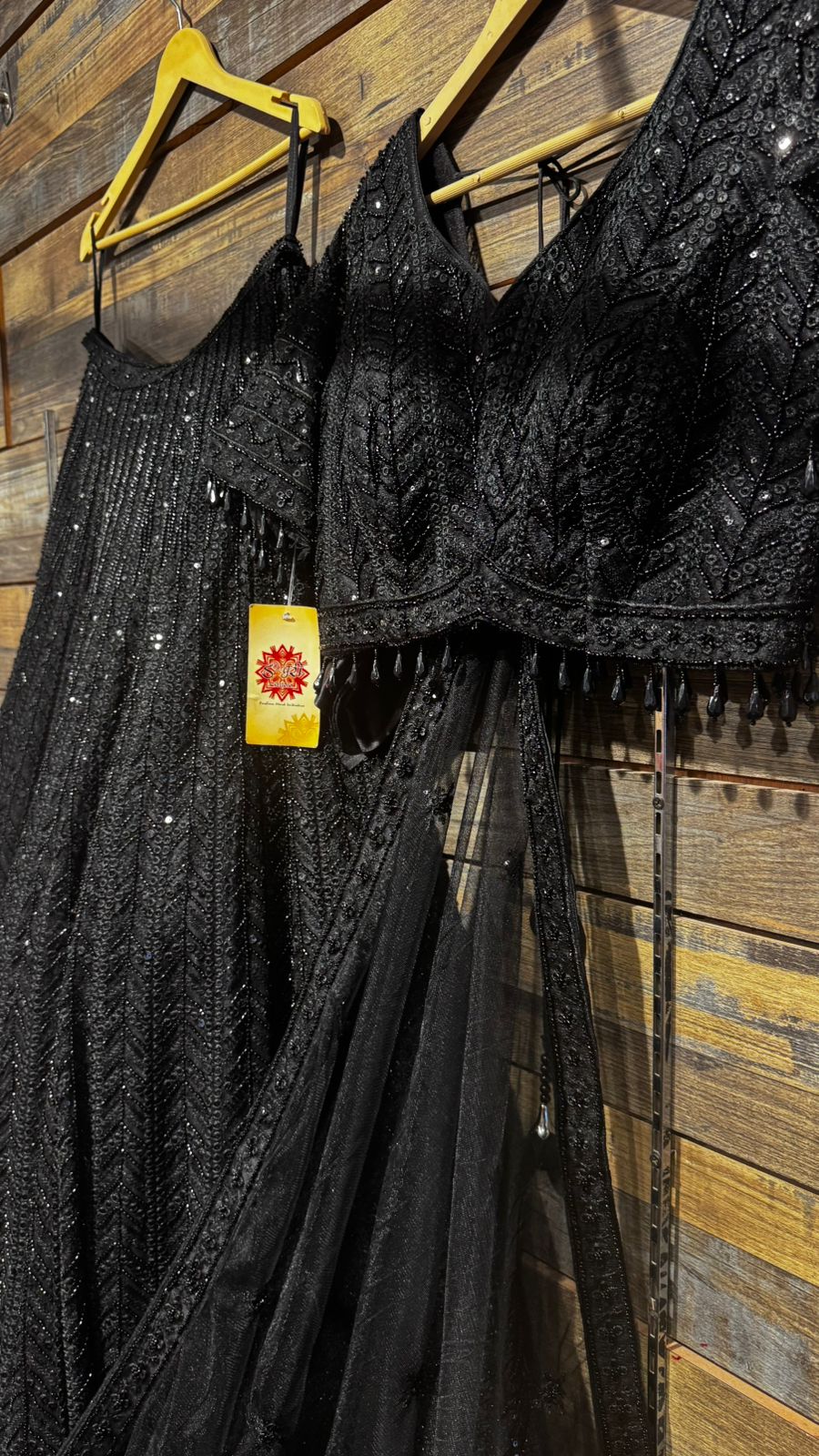 Imported Net Black Lehenga with beautiful handwork in thread and sequence teamed with full handwork blouse to brighten up your cocktail affairs