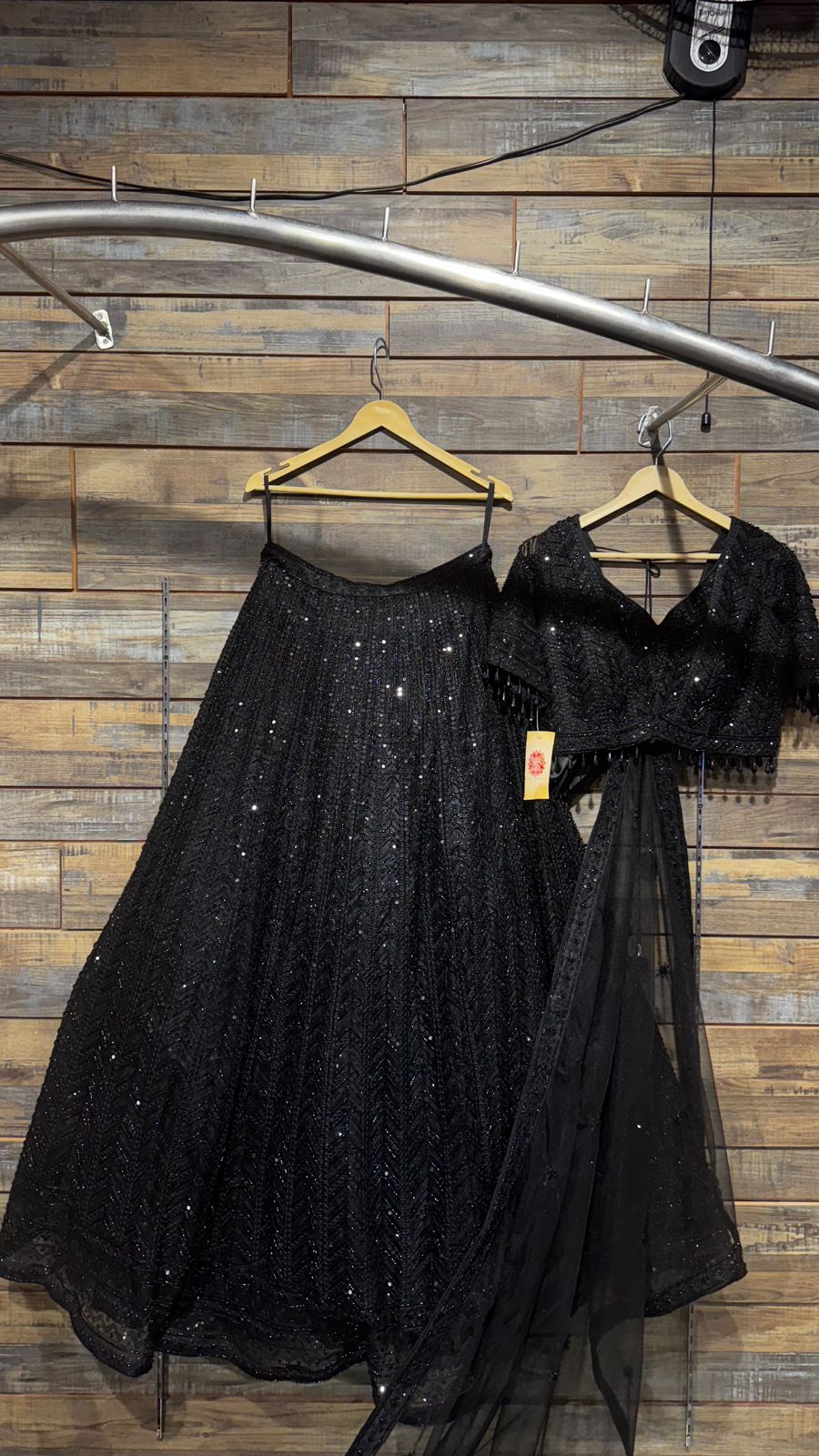 Imported Net Black Lehenga with beautiful handwork in thread and sequence teamed with full handwork blouse to brighten up your cocktail affairs