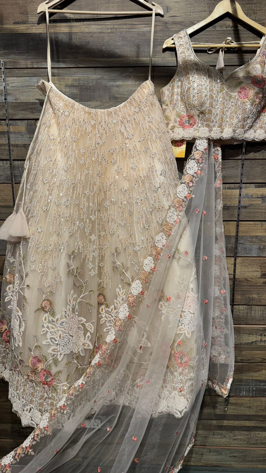 Imported Net Black Lehenga with beautiful handwork in colorful thread and swarovski teamed with full handwork blouse to brighten up your ceremonial affairs