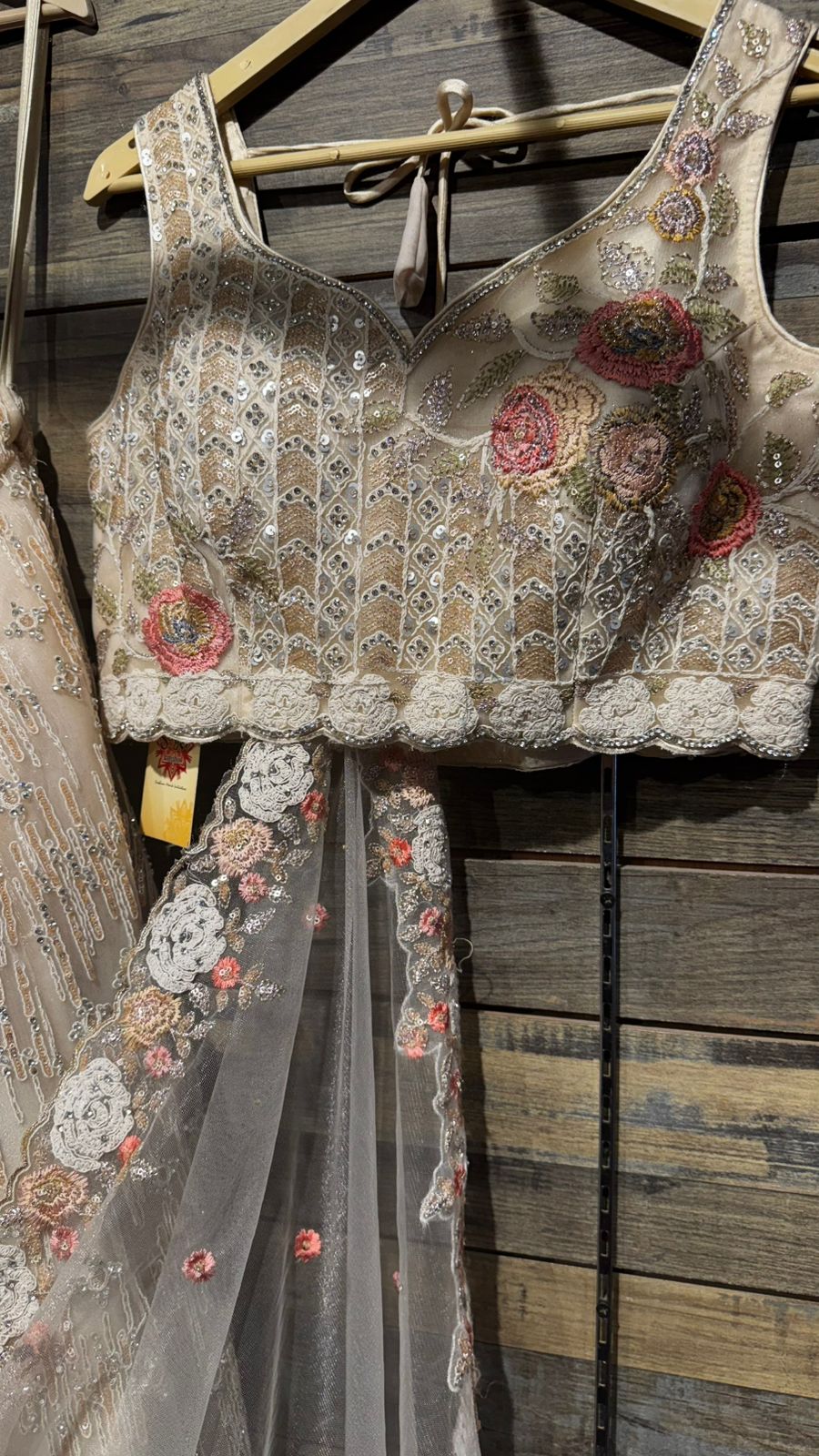 Imported Net Black Lehenga with beautiful handwork in colorful thread and swarovski teamed with full handwork blouse to brighten up your ceremonial affairs