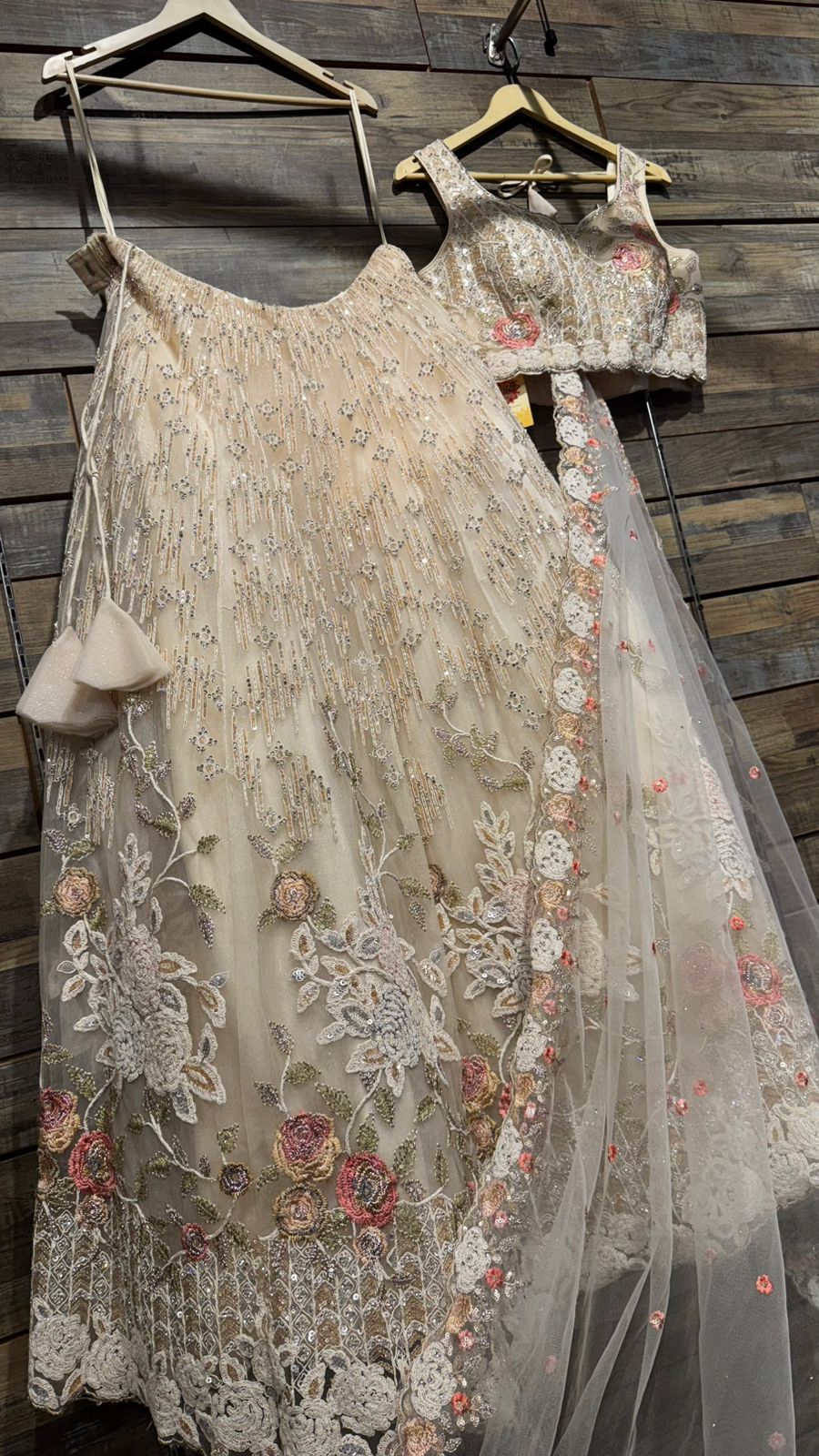 Imported Net Black Lehenga with beautiful handwork in colorful thread and swarovski teamed with full handwork blouse to brighten up your ceremonial affairs