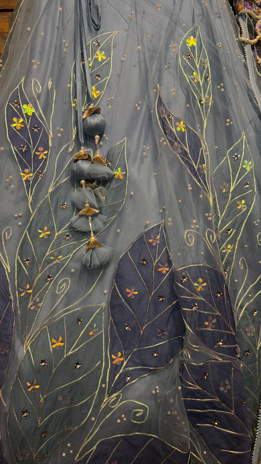 Imported Net Powder Blue Lehenga with beautiful handwork in pearl and appliqué teamed with full handwork blouse in beads with dropping shoulders along with two panels doing down to brighten up your ceremonial affairs