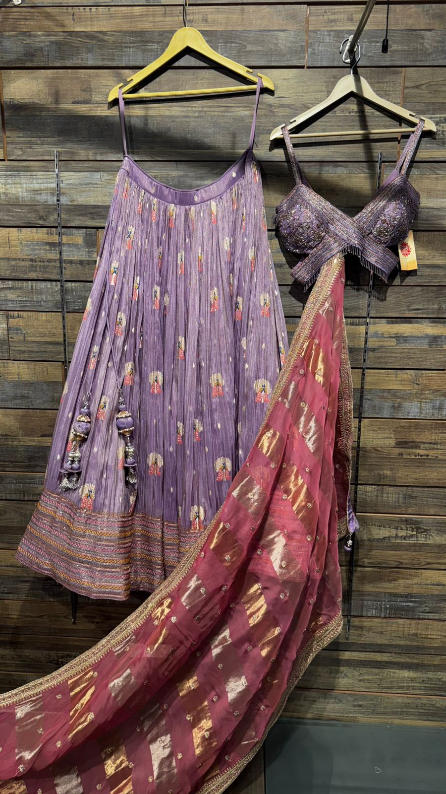 Lavender Color Lehenga with beautiful crush banarsi tissue fabric with banarsi weaving over the skirt and intricate handwork on blouse with criss cross neck pattern and organza dupatta with tissue patta weaving